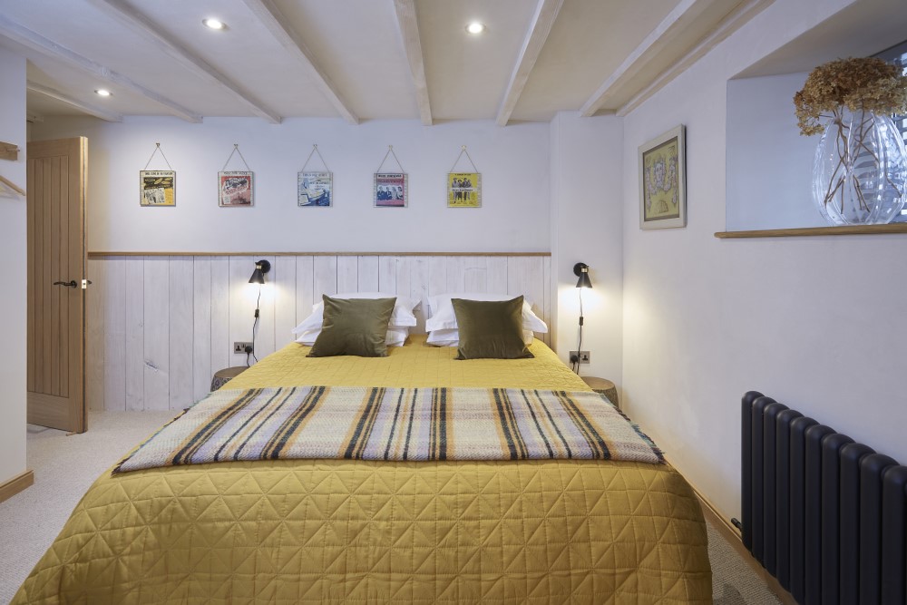 The second bedroom with either a king size bed, or it can be split into two singles