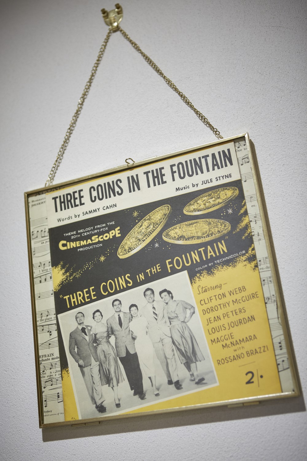 A decoration on the wall of the second bedroom, showing the vinyl record called 'Three Coins in the Fountain'