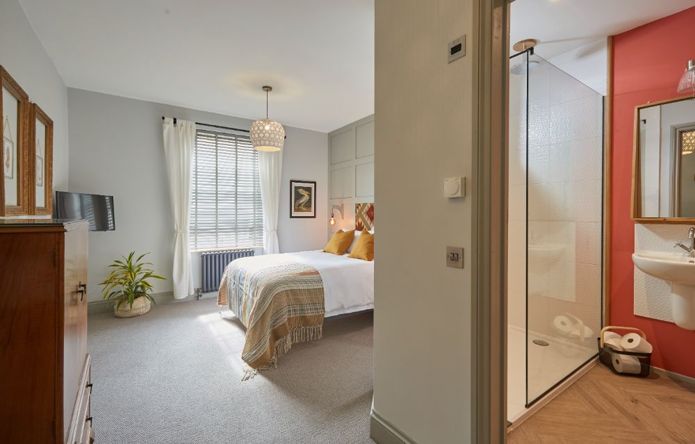 A view towards the window, looking past the bed